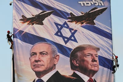 A pro-Netanyahu poster shows the Israeli leader alongside US President Donald Trump. EPA