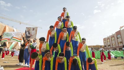 A human pyramid of performers on the parade ground.