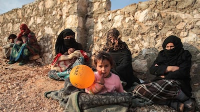 Displaced Syrians from the south of Idlib province sit out in the open in the countryside west of the town of Dana in the northwestern Syrian region. AFP