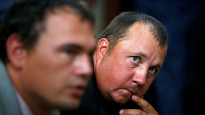 South African farmers Willem Oosthuizen and Theo Martins react after being sentenced for kidnap, assault and attempted murder in connection with forcing a man into a coffin, in Middelburg, South Africa, on October 27, 2017. Siphiwe Sibeko / Reuters