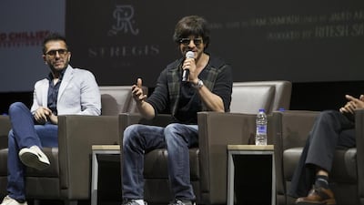 Shah Rukh Khan, centre, at a press conference at Bollywood Parks in the Dubai Parks and Resorts. Antonie Robertson / The National