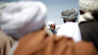 Supporters of Afghan presidential candidate Zalmai Rassoul attend an election campaign in Bagram. Ahmad Masood / Reuters