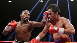 Floyd Mayweather Jr, left, will fight a rematch against Manny Pacquiao on Netflix in September. AP