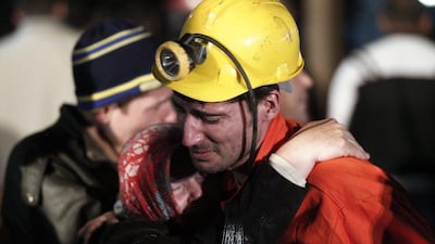 A miner hugs a relative in front of a coal mine site in Soma. An explosion and fire in the coal mine in Soma killed at least 200 miners and trapped hundreds more. Osman Orsal / Reuters