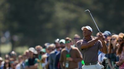 Tiger Woods watches his chip on the 18th hole during the second round in The Masters at the Augusta National Golf Club. AP
