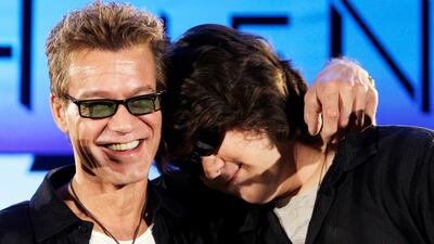 Eddie Van Halen, left, embraces his son Wolfgang Van Halen after the rock group Van Halen officially announced their North American tour during a news conference in Los Angeles on August, 13, 2007. AP Photo