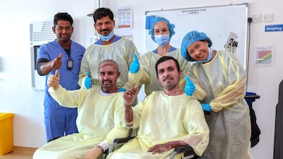 Mr Solangi and Mr Dahri with their medical team