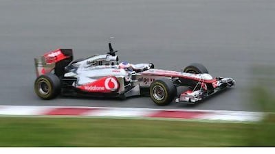 Jenson Button drives his McLaren-Mercedes car at a test session at Montmelo yesterday. Manu Fernandez / AP Photo