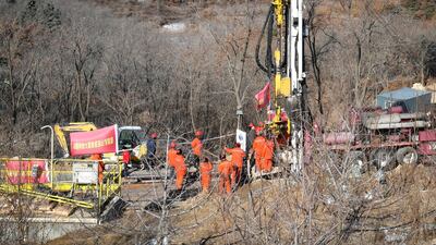 Members of a rescue team work at the site of a gold mine explosion where 22 miners are trapped underground in Qixia, in eastern China's Shandong province on January 18, 2021. AFP