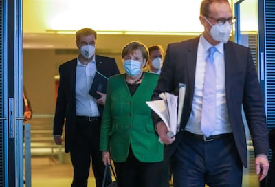 German Chancellor Angela Merkel, Bavarian State Premier Markus Soeder and Berlin Mayor Michael Mueller after a late-night meeting on the country's lockdown extension. Reuters