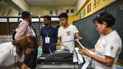Polling officers print documents from a vote counting machine after polls closed in the presidential election in Manila. Voting was under way in the Philippines on May 9 to elect a new president, with anti-establishment firebrand Rodrigo Duterte the shock favourite after an incendiary campaign in which he vowed to butcher criminals. Mohd Rasfan / AFP