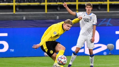 Erling Braut Haaland shoots to score his second goal during the Champions League match between Borussia Dortmund and Club Brugge. AP Photo
