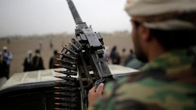 A Houthi fighter holds a weapon during a gathering aimed at mobilising more fighters for the rebel movement, in Sanaa, Yemen. AP
