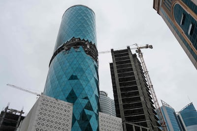 A photograph shows a damaged building in the aftermath of a drone strike in the Seef district of Manama. AFP