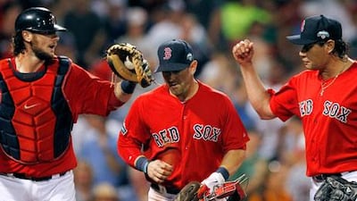 Boston Red Sox's Vicente Padilla, right, goes to congratulate Jarrod Saltalamacchia, left.