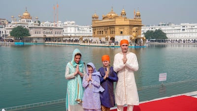 Justin Trudeau poses for a family photo at the Sikh Golden Temple in Amritsar. AFP