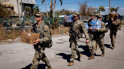 Soldiers arrive at the Matlacha-Pine Island fire control district with much-needed supplies. Reuters