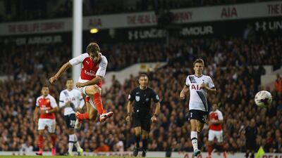 Mathieu Flamini of Arsenal scores his second goal, the winner in a 2-1 victory over Tottenham on Wednesday night in the League Cup. Ian Walton / Getty Images