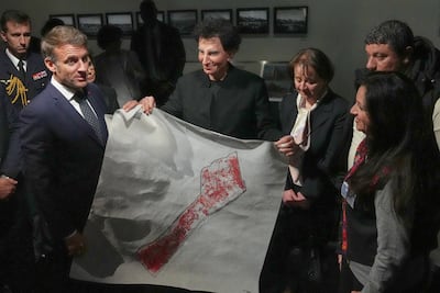 During a meeting in April with the French president Emmanuel Macron, Maha Al Daya handed him one of her maps of Gaza. AFP