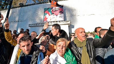 People gather outside the "Palais du Peuple" during the funeral. AFP