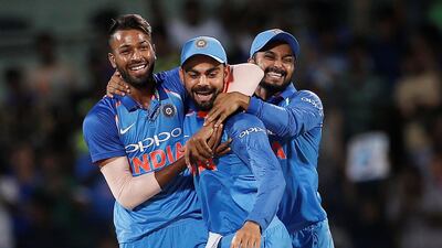 Virat Kohli, centre, says India are lucky to have Hardik Pandya, left, in their side. Adnan Abidi / Reuters