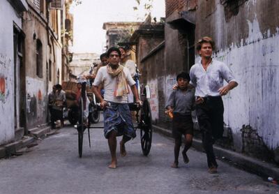 Roland Joffe, Om Puri and Patrick Swayze in City of Joy. Alamy