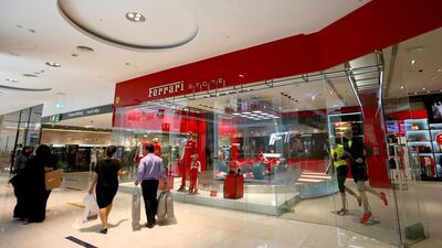 People shop at the Dubai Mall. The world awaits next week's Brexit decision. AFP