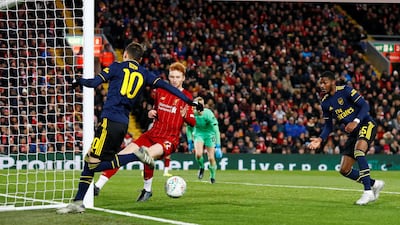 Arsenal's Ainsley Maitland-Niles, right, scores their fourth goal. Reuters