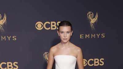 Millie Bobby Brown, wearing a cream Calvin Klein princess dress, arrives for the Primetime Emmy Awards in Los Angeles on September 17, 2017. EPA