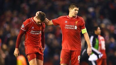Steven Gerrard, right, consoles Jordan Henderson after Liverpool's exit from the Champions League on Tuesday night. Laurence Griffiths / Getty Images