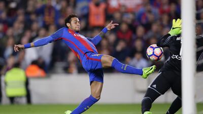 Barcelona’s Neymar, left, is challenged by Valencia’s goalkeeper Diego Alves. Manu Fernandez / AP Photo