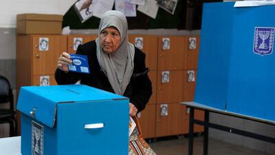 An Israeli Arab elderly citizen from Taiybe town casts her ballot at a polling station, during the Elections of the 21st Knesset of Israel. EPA