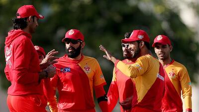 Islamabad United players celebrate the dismissal of Rameez Shahzad of UAE X1 during a Pakistan Super League warm-up match at the ICC Academy on February 7, 2017 in Dubai. Satish Kumar / The National