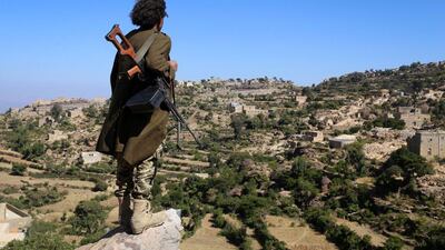 A Yemeni tribesman from the Popular Resistance Committee, supporting forces loyal to Yemen's Saudi-backed president Abdrabu Mansur Hadi, stands on top of hill in the central city of Taez on November 1, 2016. Ahmad Al Basha/AFP