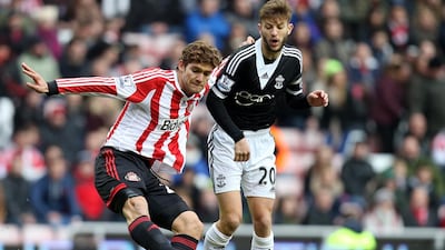 Sunderland's Marcos Alonso, left, vies for the ball with Southampton's Adam Lallana during their Premier League match at the Stadium of Light on Jan. 18. Scott Heppell / AP Photo