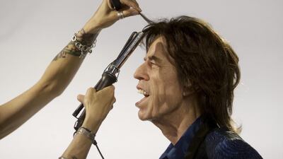 Hairdresser Virginie Dahan puts the final touches to Rolling Stones lead singer Mick Jagger’s statue at the Grevin Wax Museum in Prague on April 24, 2014. David W Cerny / Reuters