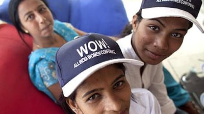 Mamta Saini, Preeti Saxena, and Param Jeet Kaur, three of New Delhi's growing band of female taxi drivers.