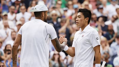 Nick Kyrgios of Australia is congratulated at the net by Brandon Nakashima of the US after winning their last-16 match on Centre Court. EPA