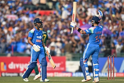 India's Ruturaj Gaikwad, left, celebrates with Virat Kohli after completing his century. AFP