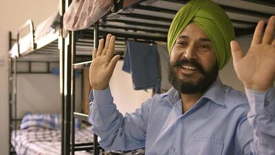 Bikram Singh, left, works as a crane operator at Arabtec. Singh’s wife and two children remain in the Punjab region of India. Singh’s daughter Harpreet, far left, is studying to become a judge.