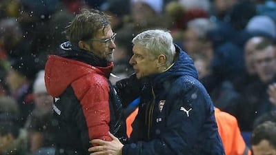 Jurgen Klopp, left has had a superior head to head against Arsene Wenger, right, ever since the German moved to Liverpool. Peter Powell / EPA