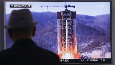 A man watches a TV news programme showing a file footage of North Korea’s rocket launch at Seoul Railway Station in Seoul. Ahn Young-joon / AP Photo.