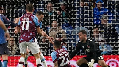 Burnley's Connor Roberts, second left, scores against Fleetwood Town at Turf Moor, Burnley. PA