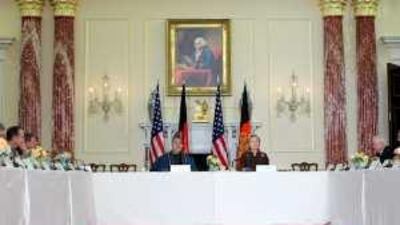 The Afghan president Hamid Karzai, centre left, and Hillary Clinton, the US secretary of state, hold opening discussions to repair relations between the countries yesterday. J Scott Applewhite / AP Photo