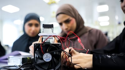 The Indian Institute of Technology in Abu Dhabi hosted an AI workshop for more than 40 Emirati high school pupils last year. Victor Besa / The National