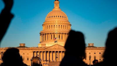 A small group of demonstrators gather outside the US Capitol on the early morning of September 21. AFP