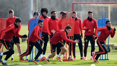 As teammates look on, Manchester United’s English midfielder Michael Carrick (L), Manchester United’s English midfielder Jesse Lingard (2nd L), Manchester United’s Spanish midfielder Ander Herrera (2nd R) and Manchester United’s Dutch midfielder Memphis Depay (R) take part in a team training session at their Carrington Training Centre in Manchester, north west England on March 16, 2016 ahead of their Uefa Europa League second leg football match against Liverpool. AFP / Paul ELLIS