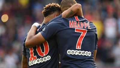 Mbappe is congratulated by Neymar. AFP