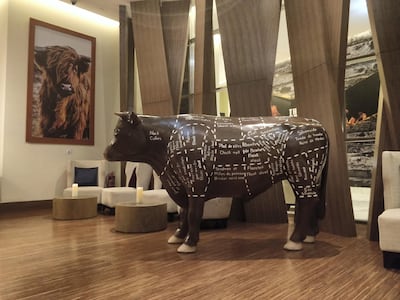 The artworks at the entrance speak to the food you can expect within