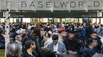 People attend the Baselworld fair. Clemens Bilan / Getty Images